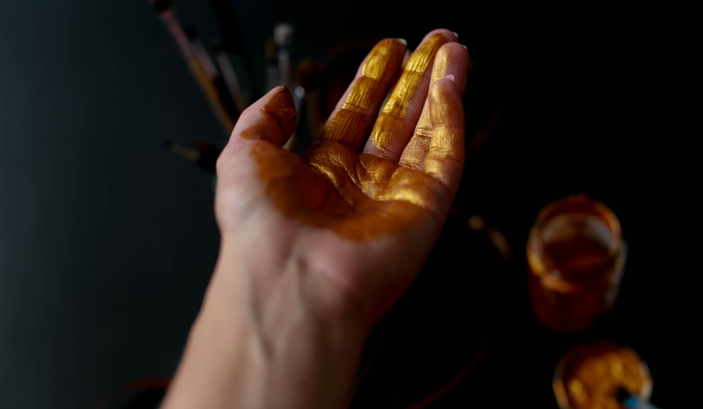 Gold smeared on a hand